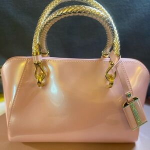 Elegant Pink Handbag with Gold Accents